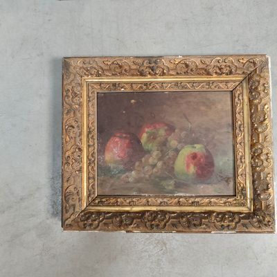 a painting of apples and grapes on the wall