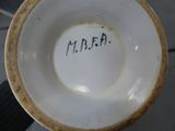 a close up of a bowl with writing on it