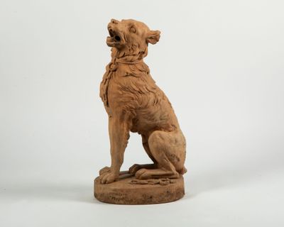 statue of a dog sitting on a pedestal with a white background