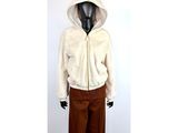 a mannequin wearing a white jacket and brown pants