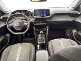 the interior of a small car with a steering wheel and dashboard
