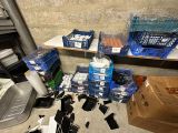 a pile of plastic containers and other items on the floor