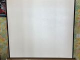 a projection screen in the corner of a room