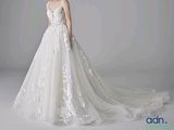 a photo of a woman in a wedding dress posing for a picture