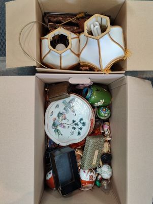 a box full of assorted items sitting on the floor