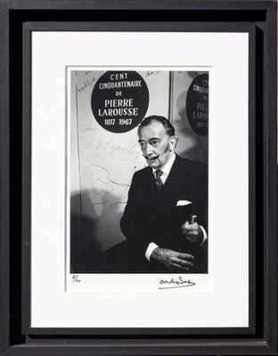 an old black and white photo of a man in a suit and tie