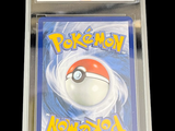 the pokemon card is in a clear plastic case