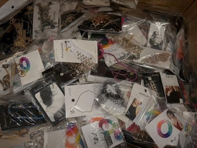 a box full of assorted jewelry and other items