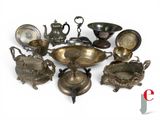 a lot of silver items that are on the table