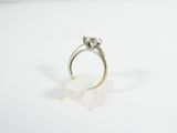 a close up of a ring with a diamond on top of it