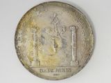 an old coin with a picture of a man on it