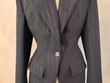 an image of a suit on a mannequin stand