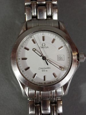 an image of a close up of a wrist watch on a table