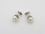 a pair of pearl and diamond cufflinks
