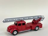 a red toy fire truck with a ladder on it