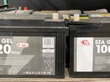 two black batteries are sitting on top of a shelf in a store
