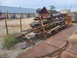 a large pile of junk sitting on the side of the road