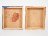two wooden boxes that have a picture of a heart in them