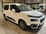 the white citrole van is parked in a garage