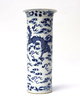 a blue and white vase with a dragon design on it