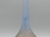 a glass vase that is sitting on a table