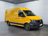 the yellow van is parked in the large room of the building