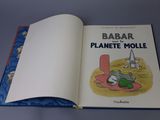an open book with a picture of a mouse on it