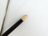 two chopsticks sitting next to each other on a table