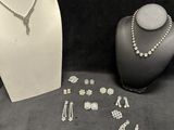 a lot of jewelry that is on display on a table