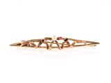 an image of a close up of a gold hair pin