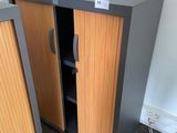 pair of metal and wood storage cabinets in a room