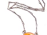 a picture of a necklace with an orange flower on it