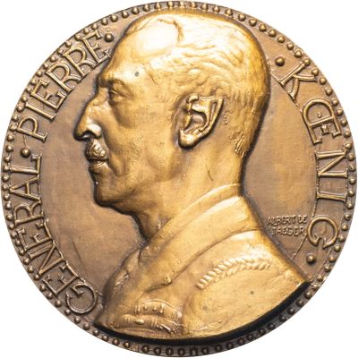 an image of a gold medal with a man ' s face on it