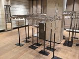 many glasses on display in a glass case in a store