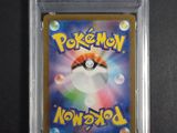 a close up of a pokemon card in a clear plastic case