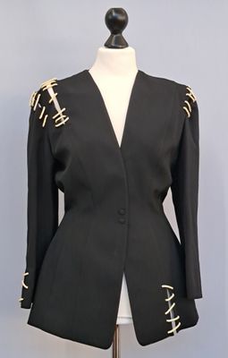 a picture of a black jacket on a mannequin mannequin