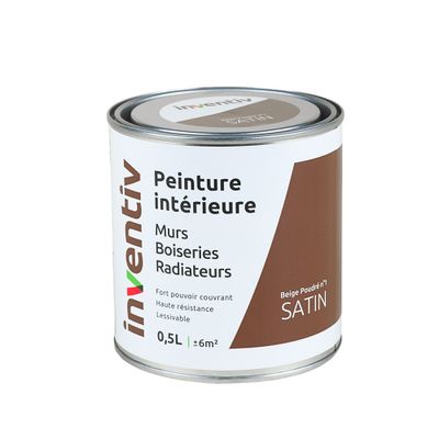 le pot de peinture est marron et blanc, avec une bande marron