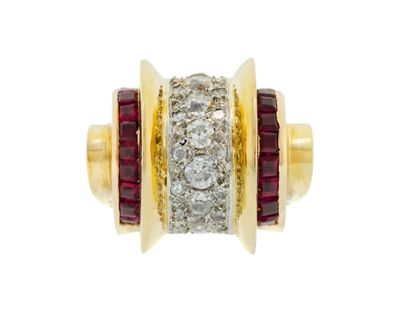 a close up of a gold ring with diamonds and red stones