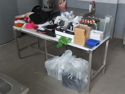 a table with a bunch of items on it in the kitchen