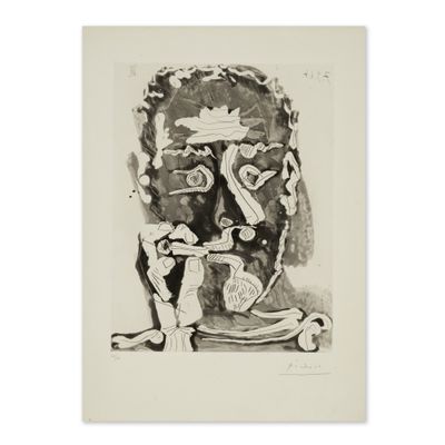 a black and white drawing of a man ' s face on a piece of paper