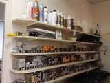 a room with a lot of bottles and shelves on the wall