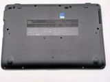 a close up of a laptop with a battery on it