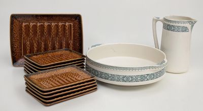 a lot of plates and bowls that are sitting on a table