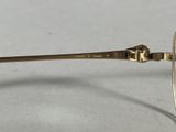 an image of a pair of glasses sitting on top of a table