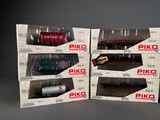 three boxed boxes of piko model trains sitting on a table