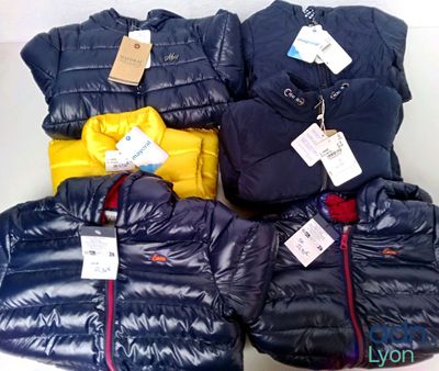 a pile of clothing that is on display in a store