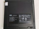 a black laptop with a battery on top of it