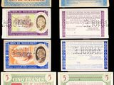 un ensemble de cinq billets de banque différents sur fond noir