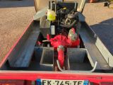 a red fire hydrant sitting in the back of a truck