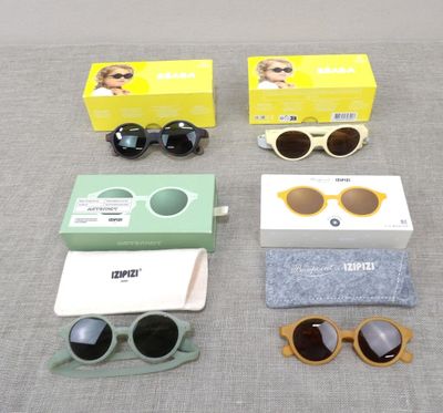 several pairs of sunglasses, sunglasses, a case, and a pair of glasses
